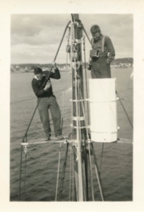 Image of Bill Rand in rigging; Fred Edgarton in ice barrel